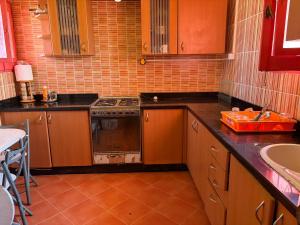a kitchen with a stove and a sink at Al Obayed Garden Villa in Marsa Matruh