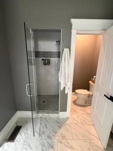 a bathroom with a glass shower with a toilet at Room in private house for Rent in Nice Neighborhood in Midlothian