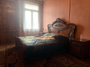 a bedroom with a bed and a window at Vefxos Guest home in Anaklia