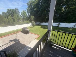 a suitcase sitting on a patio on a porch at Room in private house for Rent in Nice Neighborhood in Midlothian +1 photo