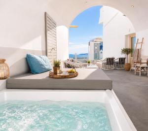 a pool in the middle of a living room at Cliff Caldera Modern Suites -Volcano, Sunset & Caldera View in Fira