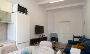 a living room with a couch and a table at 458 - Favlyn Boutique Apartments in Sliema +18 photos