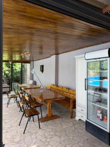 a dining room with a wooden table and chairs at Blue Garden in Nor Hachyn