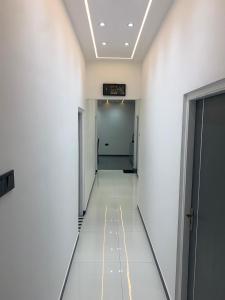 a hallway of an office building with a sign on the ceiling at Elysian Ridge Villa in Welimada