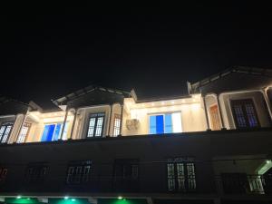 a building at night with blue lights on it at Elysian Ridge Villa in Welimada