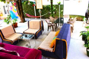 a patio with couches and a table and chairs at TravelBreak in Podgorica
