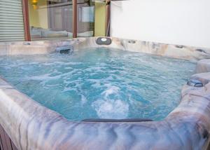 a jacuzzi tub in a room at Unity Beach in Brean
