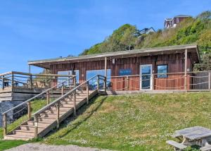 a house on the side of a hill at Millendreath Beach Resort in Looe