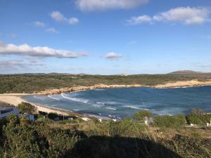 a view of the beach from the top of a hill at Des Artistes Son Parc in Son Parc