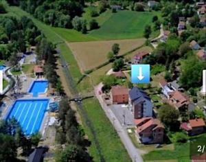 an aerial view of a house with a swimming pool at Apartman Jakovljević in Gornja Toplica