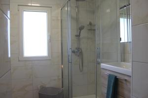 a bathroom with a shower and a sink at CASA K2 - Lago Maggiore in Castelveccana +19 photos