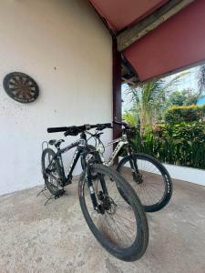 two bikes parked on the side of a building at Itawis Resort - Ivanna's Room in Silang