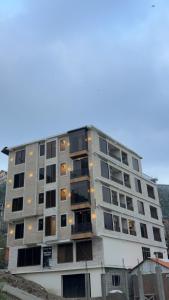 a tall building with many windows on it at Malam jabba Hotel reservation in Swat