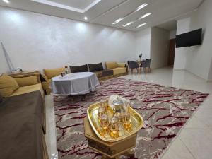 a large living room with a couch and a table at Massira Green Park Serenity in Kenitra