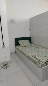 a bedroom with a bed in a white room at Em capsule Hostel Baku in Baku