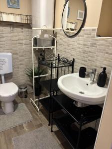 a bathroom with a sink and a toilet at SALT & SOUL in Senj +18 photos