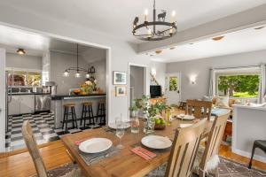 a dining room and living room with a table and chairs at 7th Street Bungalow in Livingston