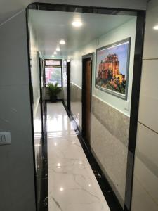 a hallway in a building with a painting on the wall at Hotel keshri Nandan in Nāgaur