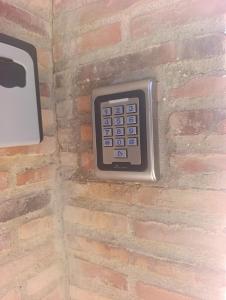 a remote control embedded in a brick wall at Loft A el Ramellet in Alginet