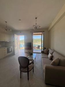 a living room with a couch and a chair at Orizon Sea View in Vathi