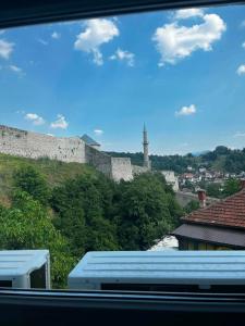 a view of a castle from a window at Apartman Kastel in Travnik