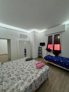 a bedroom with a bed and a blue couch at Valdambra B&B in Ambra