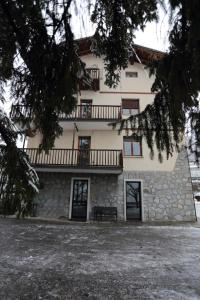 a building with a bench in front of it at Beauregard apartment in Aosta