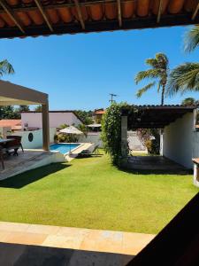 a view of the backyard of a house with a pool at Casa Paraíso Guajiru in Trairi