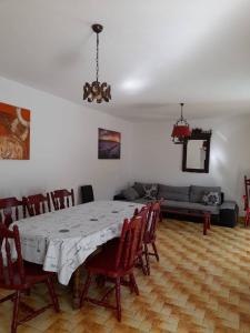 a dining room with a table and chairs at Villa Marina in Poljica