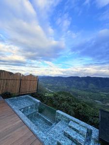a view of a glass shower on a deck at Montecielo in Pitalito +6 photos