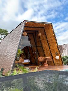 a house shaped like a house with a roof at Montecielo in Pitalito