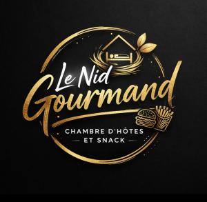a sign that reads le nitz gourmet withumes and cakes at le nid gourmand in Andryes