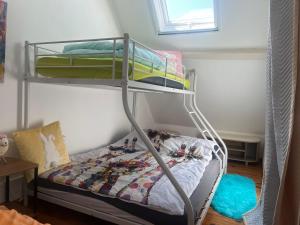 a bedroom with a bunk bed with a train on it at Pets Home by Oxyne in Louches