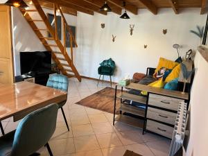 a living room with a couch and a table at Pets Home by Oxyne in Louches