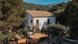 an aerial view of a white house with trees at Villa Totò Resort in Cefalù