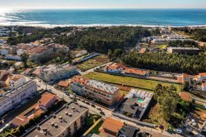 an aerial view of a city with the ocean at Learn Fun Madalena - Shared Swimming pool in Madalena