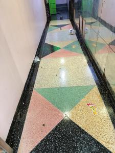 a room with a tile floor with a mirror at City Brisa cbd in Nairobi