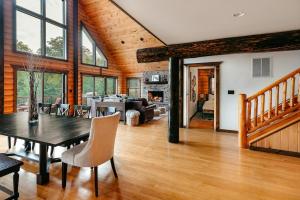 a dining room and living room with a table and chairs at Red Tara Sanctuary in Catskill