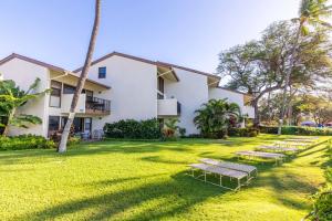 a row of benches in front of a building at Makani A Kai Resort A-3 in Wailuku
