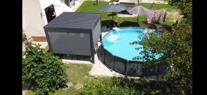 an overhead view of a swimming pool in a yard at Apartma Minka in Miklavž pri Ormožu