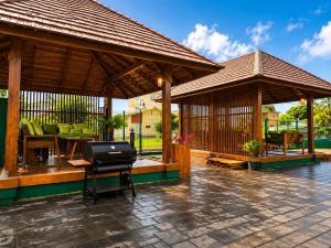 a pavilion with a grill on a patio at DOLFIJN STUDIOS 4 Spacious 2BR Apartment Fast WiFi AC North Paramaribo in Paramaribo