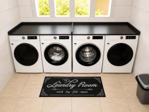 two washing machines and a chalkboard sign in a laundry room at DOLFIJN STUDIOS 4 Spacious 2BR Apartment Fast WiFi AC North Paramaribo in Paramaribo +7 photos