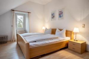 a bedroom with a large bed and a window at Herrenhaus Carolinenhof in Groß Plasten +254 photos