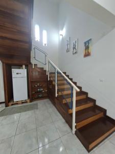 a staircase in a house with a stair case at Quinta de 4 Pilares in Canavial