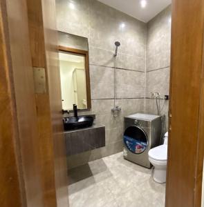 a bathroom with a sink and a toilet at Toot Suites in Abha +15 photos