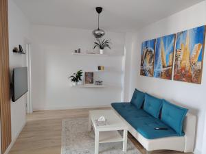 Un televizor și/sau centru de divertisment la DaFi Apartament