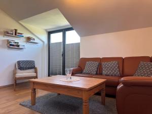 a living room with a couch and a coffee table at Ferienwohnung in Burhave in Burhave