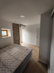 a bedroom with a bed in a room with a window at Roman Paradise Villa with Pool in Koper