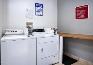 a white washer and dryer in a room at Hotel Blu in Columbia
