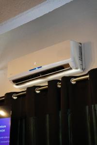a toaster sitting on top of a rack in a room at Dahlia suite & spa in Nîmes
